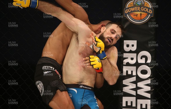 081218 - Cage Warriors 100 - Aiden Lee (grey shorts) v Dean Trueman (blue shorts) during their featherweight title fight