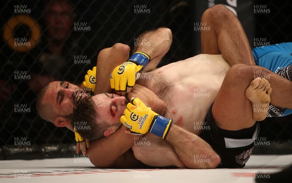 081218 - Cage Warriors 100 - Aiden Lee (grey shorts) v Dean Trueman (blue shorts) during their featherweight title fight