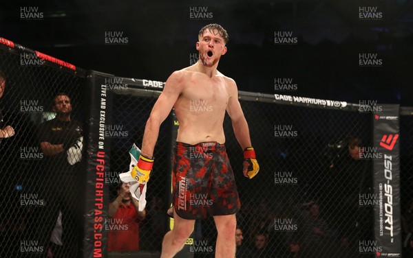 091218 - Cage Warriors 100 - Wales' Jack Shore celebrates victory over Mike Ekundayo to win the world title