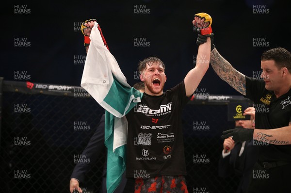 091218 - Cage Warriors 100 - Wales' Jack Shore celebrates victory over Mike Ekundayo to win the world title