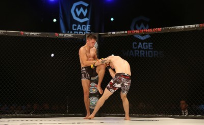 290918 - Cage Warriors 97 - Luke Shanks v Jason Jenkins (Ebbw Vale) - Jenkins gets a kick in