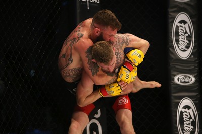 290918 - Cage Warriors 97 - Michael Corston (Black Shorts) v Struan Croxton, Port Talbot (Black and Red shorts) - Corston gets a hold of Croxton