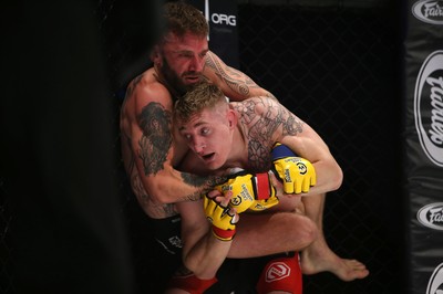 290918 - Cage Warriors 97 - Michael Corston (Black Shorts) v Struan Croxton, Port Talbot (Black and Red shorts) - Corston gets a hold of Croxton