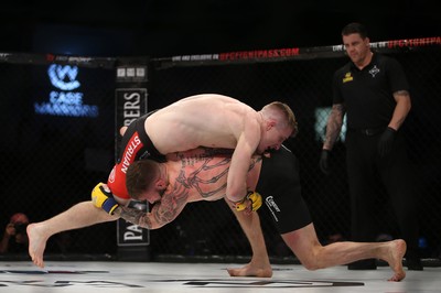 290918 - Cage Warriors 97 - Michael Corston (Black Shorts) v Struan Croxton, Port Talbot (Black and Red shorts) - 