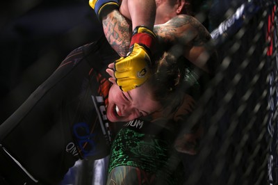 290918 - Cage Warriors 97 - Cory McKenna (Black Top) v Micol DiSegni (Green) - 