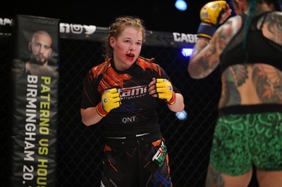 290918 - Cage Warriors 97 - Cory McKenna (Black Top) v Micol DiSegni (Green) - 