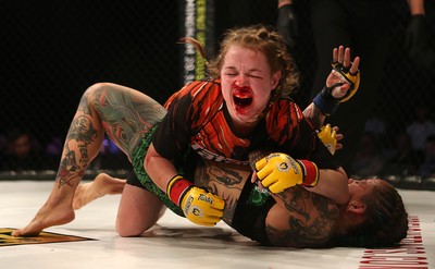 290918 - Cage Warriors 97 - Cory McKenna (Black Top) v Micol DiSegni (Green) - 