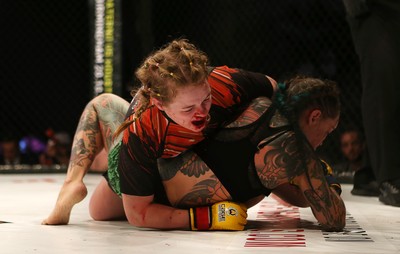 290918 - Cage Warriors 97 - Cory McKenna (Black Top) v Micol DiSegni (Green) - 