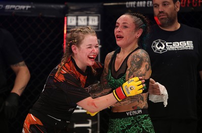 290918 - Cage Warriors 97 - Cory McKenna (Black Top) v Micol DiSegni (Green) - Smiles and hugs after the fight