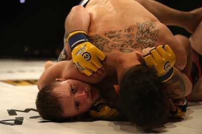 290918 - Cage Warriors 97 - Jamie Richardson (Black and red shorts) v Pontypridd's Aaron Khalid (Blue shorts)