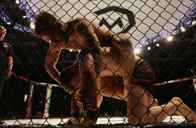 290918 - Cage Warriors 97 - Jamie Richardson (Black and red shorts) v Pontypridd's Aaron Khalid (Blue shorts)