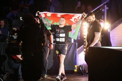 290918 - Cage Warriors 97 - Pontypool's Mason Jones (Black shorts) v Kasper Formela (Red shorts) - Jones makes his entrance