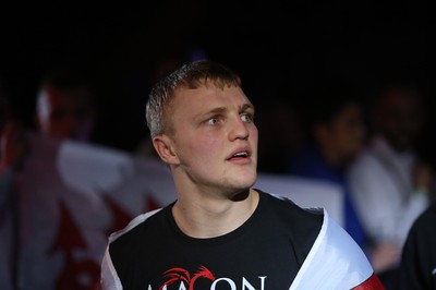 290918 - Cage Warriors 97 - Pontypool's Mason Jones (Black shorts) v Kasper Formela (Red shorts) - Jones makes his entrance