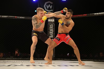 290918 - Cage Warriors 97 - Pontypool's Mason Jones (Black shorts) v Kasper Formela (Red shorts) - 