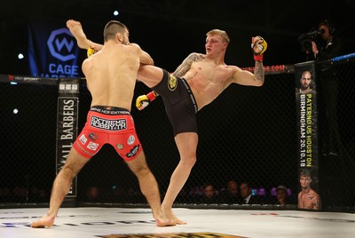 290918 - Cage Warriors 97 - Pontypool's Mason Jones (Black shorts) v Kasper Formela (Red shorts) - 