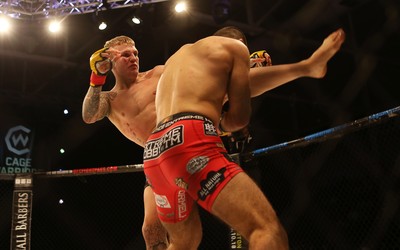 290918 - Cage Warriors 97 - Pontypool's Mason Jones (Black shorts) v Kasper Formela (Red shorts) - 