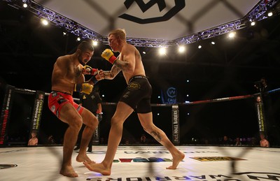 290918 - Cage Warriors 97 - Pontypool's Mason Jones (Black shorts) v Kasper Formela (Red shorts) - 