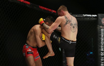 290918 - Cage Warriors 97 - Pontypool's Mason Jones (Black shorts) v Kasper Formela (Red shorts) - 