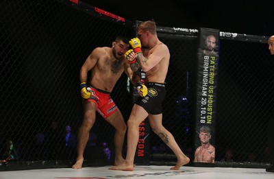 290918 - Cage Warriors 97 - Pontypool's Mason Jones (Black shorts) v Kasper Formela (Red shorts) - 