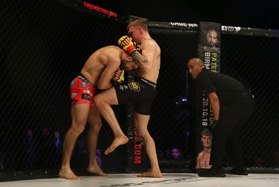 290918 - Cage Warriors 97 - Pontypool's Mason Jones (Black shorts) v Kasper Formela (Red shorts) - 