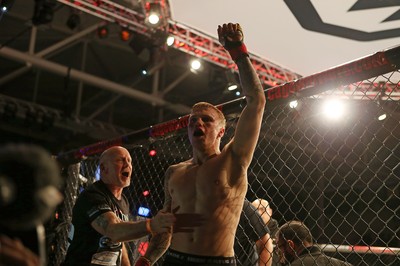 290918 - Cage Warriors 97 - Pontypool's Mason Jones (Black shorts) v Kasper Formela (Red shorts) - Jones celebrates the victory