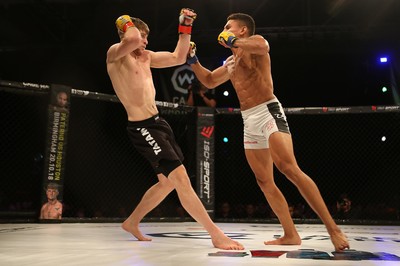 290918 - Cage Warriors 97 - Wales' Jack Shore (Black shorts) v Wesley Maia (White shorts) - 