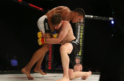 290918 - Cage Warriors 97 - Wales' Jack Shore (Black shorts) v Wesley Maia (White shorts) - 