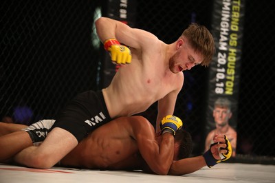 290918 - Cage Warriors 97 - Wales' Jack Shore (Black shorts) v Wesley Maia (White shorts) - Shore finishes off Maia