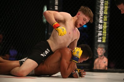 290918 - Cage Warriors 97 - Wales' Jack Shore (Black shorts) v Wesley Maia (White shorts) - Shore finishes off Maia