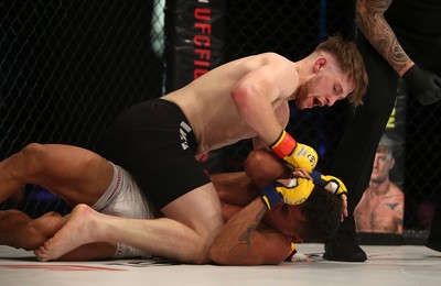 290918 - Cage Warriors 97 - Wales' Jack Shore (Black shorts) v Wesley Maia (White shorts) - Shore finishes off Maia