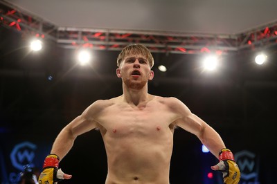 290918 - Cage Warriors 97 - Wales' Jack Shore (Black shorts) v Wesley Maia (White shorts) - Shore celebrates