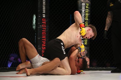 290918 - Cage Warriors 97 - Wales' Jack Shore (Black shorts) v Wesley Maia (White shorts) - Shore finishes off Maia