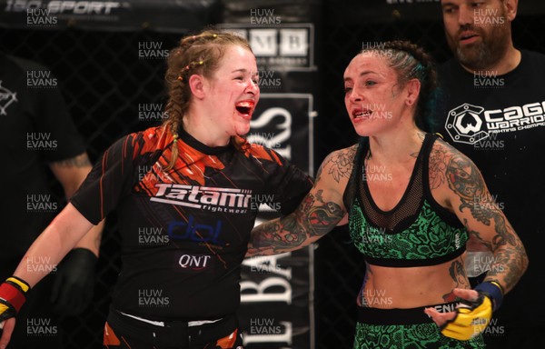 290918 - Cage Warriors 97 - Cory McKenna (Black Top) v Micol DiSegni (Green) - Smiles and hugs after the fight