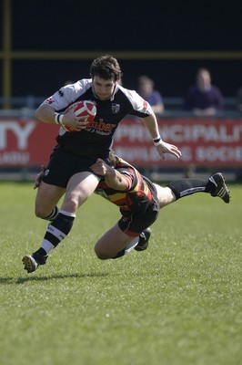 17.04.10 Carmarthen Quins RFC v Pontypridd RFC - Swales Cup semi final - Pontypridd's Gavin Dacey is caught by Carmarthen's Andrew Banfield.  