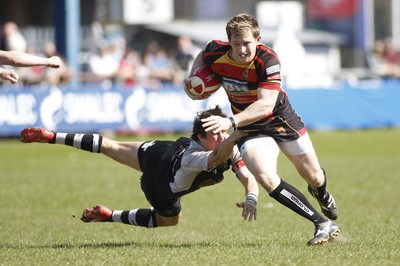 17.04.10 Carmarthen Quins RFC v Pontypridd RFC - Swalec Cup semi final - Carmarthen's Andrew Banfield steps inside Pontypridd's Rhus Downes. 