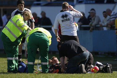 17.04.10 Carmarthen Quins RFC v Pontypridd RFC - Swalec Cup semi final - Pontypridd's Aaron Bramwell receives treatment for a serious leg injury. 