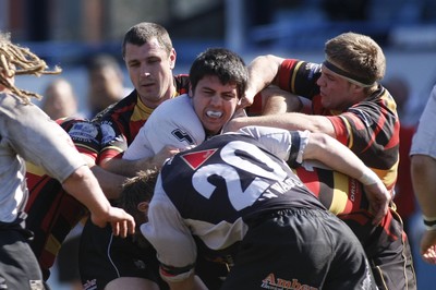 17.04.10 Carmarthen Quins RFC v Pontypridd RFC - Swalec Cup semi final - Pontypridd's Matthew Nuthall feels the full force of the Carmarthen defense. 