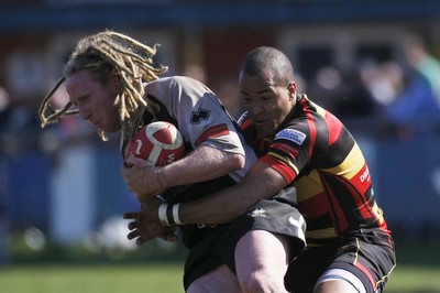 17.04.10 Carmarthen Quins RFC v Pontypridd RFC - Swalec Cup semi final - Pontypridd's Wayne O'Connor is caught by Carmarthen's Jamie Davies 