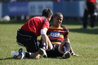 17.04.10 Carmarthen Quins RFC v Pontypridd RFC - Swalec Cup semi final - Carmarthen's Jamie Davies is treated for a leg injury which ends his game early. 