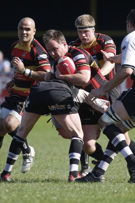 17.04.10 Carmarthen Quins RFC v Pontypridd RFC - Swalec Cup semi final - Carmarthen's Wayne Williams is tackled by Pontypridd's Wayne O'Connor. 