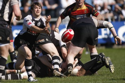 17.04.10 Carmarthen Quins RFC v Pontypridd RFC - Swalec Cup semi final - Pontypridd's Kristian Baller spreads the ball wide. 