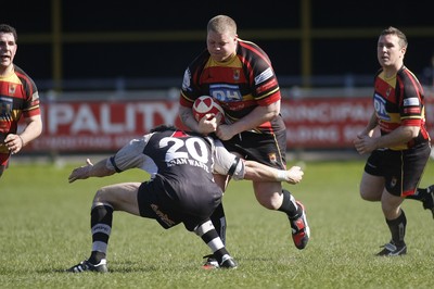 17.04.10 Carmarthen Quins RFC v Pontypridd RFC - Swalec Cup semi final - Carmarthen's Math Monaghan charges at Pontypridd's Darren Waters.  