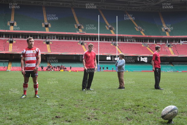 110513 - Camarthen Athletic v Gorseinon - Webb Ellis Youth Cup Final - Wales' Leigh Halfpenny offers kicking advice to Gorseinon's Sam Evans before the game 