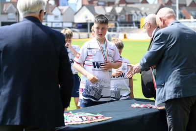 210525 - Carmarthen v Swansea - WSRU Junior Group - U11s DC Thomas Plate Final - Swansea players collect their medals at full time