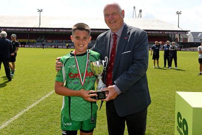 210525 - Carmarthen v Swansea - WSRU Junior Group - U11s DC Thomas Plate Final - Harri Jones of Carmarthen is presented the trophy at full time