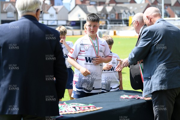 210525 - Carmarthen v Swansea - WSRU Junior Group - U11s DC Thomas Plate Final - Swansea players collect their medals at full time