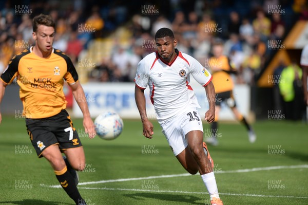 100819 - Cambridge United v Newport County - Sky Bet League 2 -  Newport's Tristan Abrahams moves for the ball watched by Luke Hannant of Cambridge