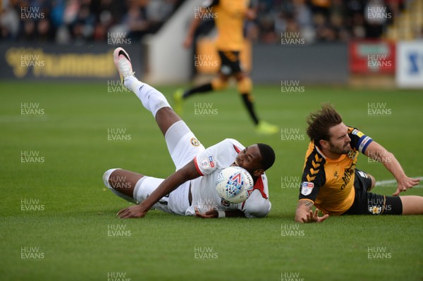 100819 - Cambridge United v Newport County - Sky Bet League 2 -  Newport's Jamille Matt is brought down in the penalty area by Cambridge's Greg Taylor