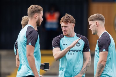 300825 - Cambridge United v Newport County - Sky Bet League 2 - Newport County Michael Spellman with team mates before the match 