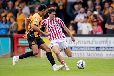 300825 - Cambridge United v Newport County - Sky Bet League 2 - Newport County’s Anthony Driscoll-Glennon and Cambridge United’s Mamadou Jobe